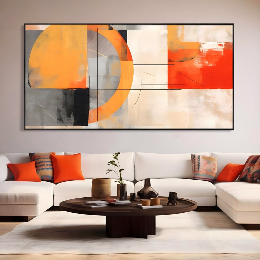 Tablou canvas cu pictura abstracta cu cerc galben, in rama de aluminiu negru, pe perete intr-un living